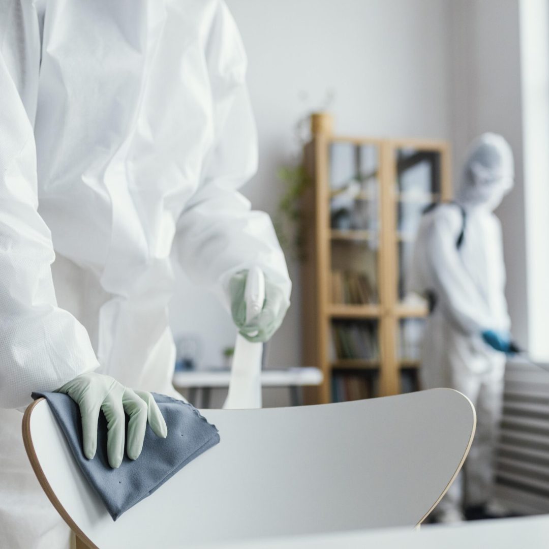 people-disinfecting-biohazard-area